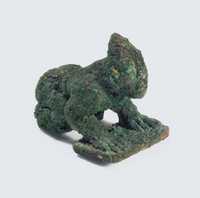 WESTERN HAN PERIOD (206 BC- AD 8) A SMALL YUNNAN ARCHAIC BRONZE FIGURE OF A KNEELING MAN